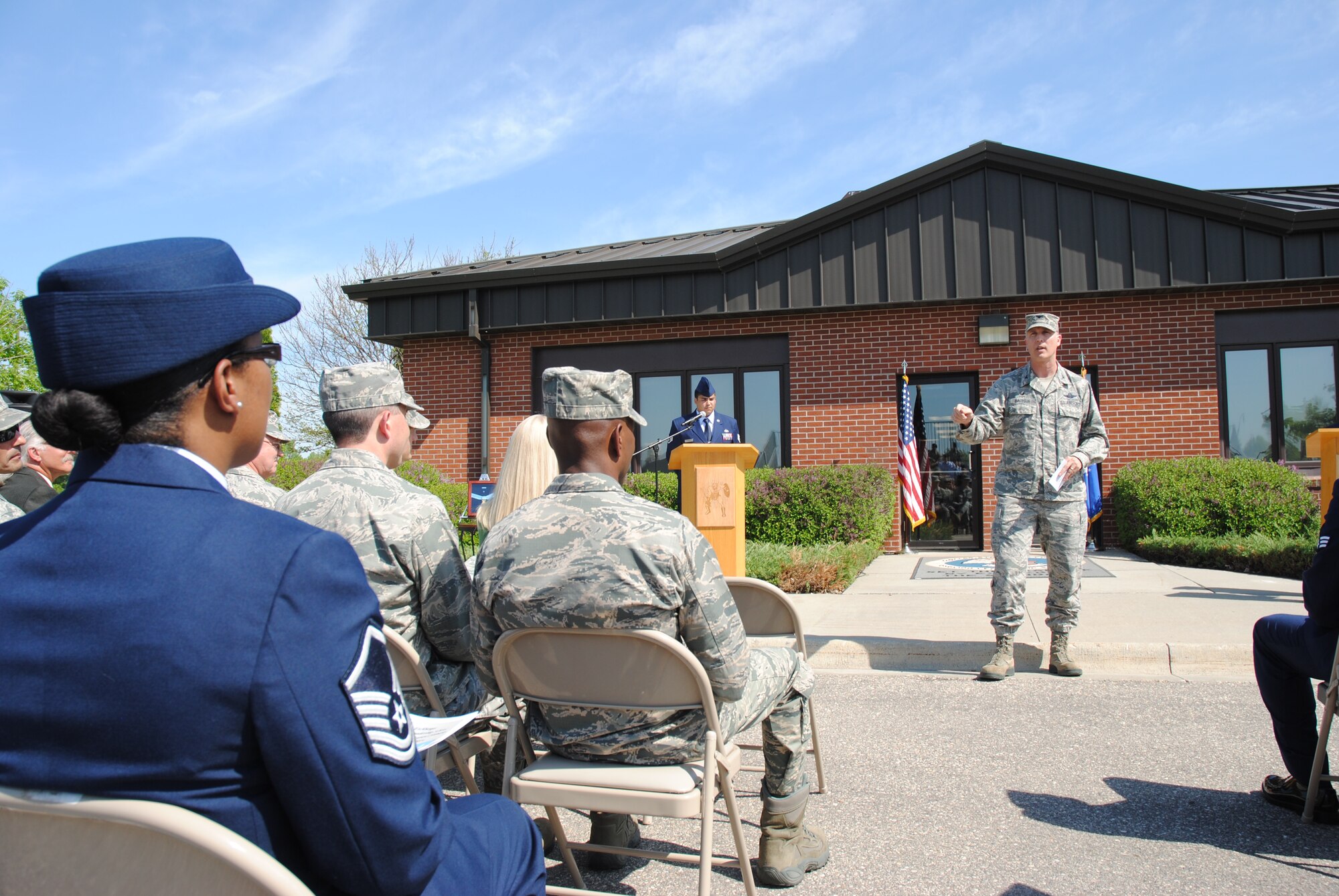 Col. Paul Bauman, 319th Air Base Wing commander, delivers closing remarks during the building dedication ceremony for the Chief Master Sgt. Richard L. Etchberger Airman Leadership School held June 4, 2014, on Grand Forks Air Force Base, N.D. “It is only fitting that our airman leadership school be named after one of the giants of our Air Force," said Bauman. (U.S. Air Force photo/Staff Sgt. Luis Loza Gutierrez) 
