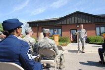 Col. Paul Bauman, 319th Air Base Wing commander, delivers closing remarks during the building dedication ceremony for the Chief Master Sgt. Richard L. Etchberger Airman Leadership School held June 4, 2014, on Grand Forks Air Force Base, N.D. “It is only fitting that our airman leadership school be named after one of the giants of our Air Force," said Bauman. (U.S. Air Force photo/Staff Sgt. Luis Loza Gutierrez) 
