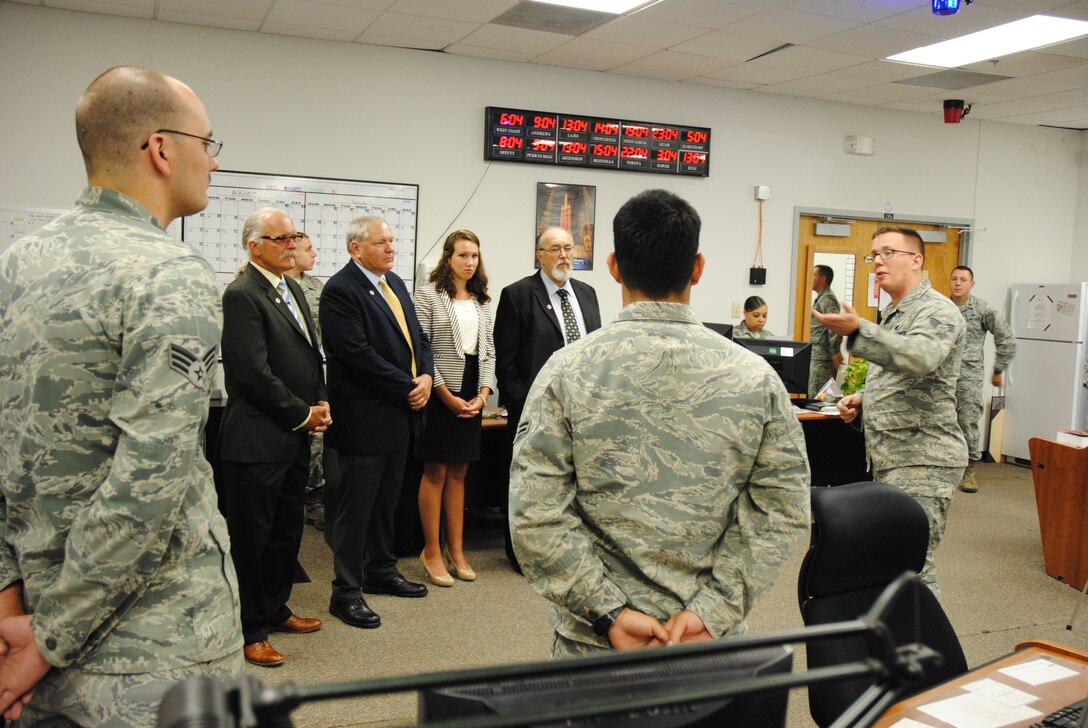 On June 4, 2014, members of the Chief Master Sgt. Richard L. Etchberger family tour one of the 319th Communications Squadron facilities on Grand Forks Air Force Base, N.D. The family of the heroic Air Force senior NCO was given a tour of some facilities and units as part of their official visit to the base. (U.S. Air Force photo/Staff Sgt. Luis Loza Gutierrez) 
