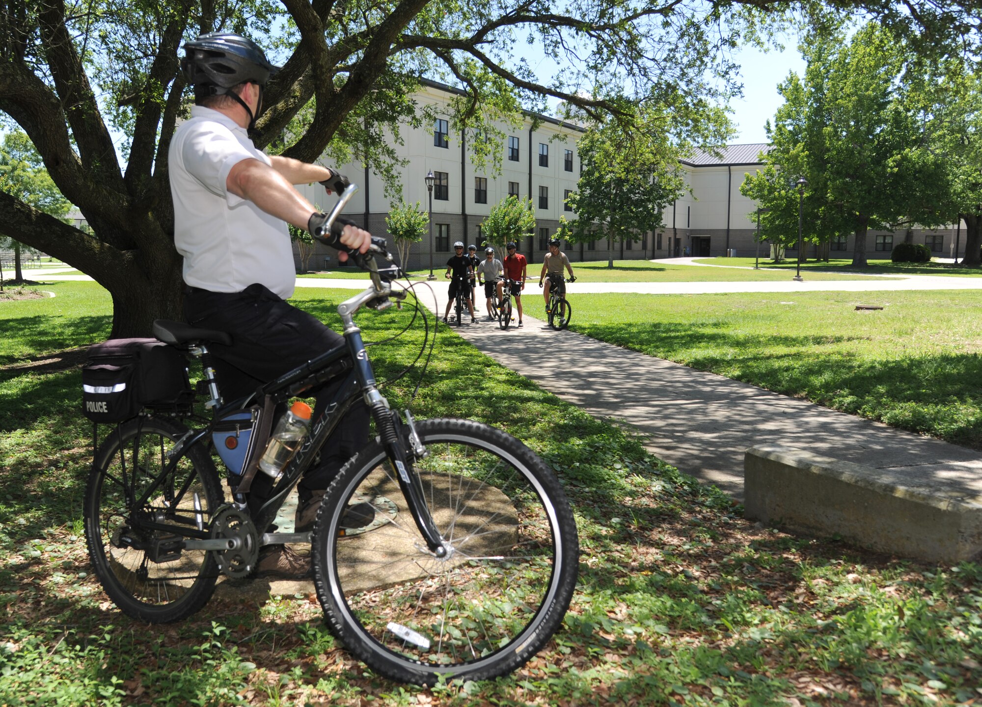 Warren Breckinridge, 81st Security Forces Squadron unit trainer, explains the next portion of bicycle training class June 4, 2014, at Bryan Hall, Keesler Air Force Base, Miss. The 81st SFS held a five-day bicycle training class June 2-6, 2014, for Keesler law enforcement Airmen which consists of bike safety, road hazards, proper stopping, use of bike as a defense mechanism, and dismounts at high speed as well as a total bike ride of over 100 miles. Bike patrols are a stealthy and versatile option for security forces officers, which can be used for special events, community policing, and crime prevention. (U.S. Air Force photo by Kemberly Groue)