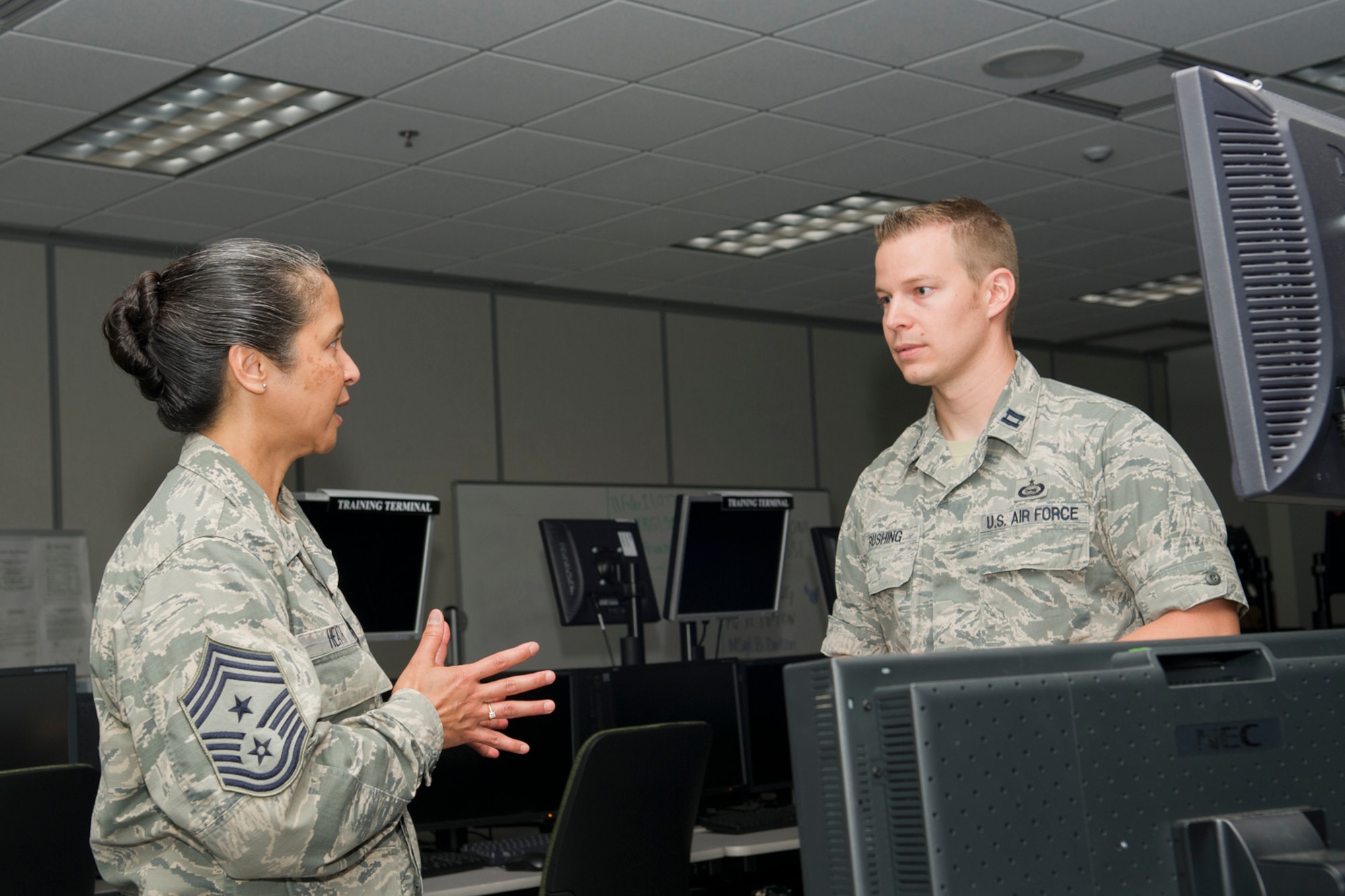 GOODFELLOW AIR FORCE BASE, Texas -- Chief Master Sgt. Arleen K. Heath, Air Force Intelligence, Surveillance and Reconnaissance Command Chief, talks with Capt. Gregory L. Rushing, 315th Training Squadron Distributed Common Ground System-Formal Training Unit flight commander, about the training the FTU provides to students bound for DCGS assignments during a visit to the Joint Intelligence Technical Training Facility here June 3. This was Heaths second visit to Goodfellow and her first to the JITTF that recently opened. (U.S. Air Force photo/ Staff Sgt. Laura R. McFarlane)