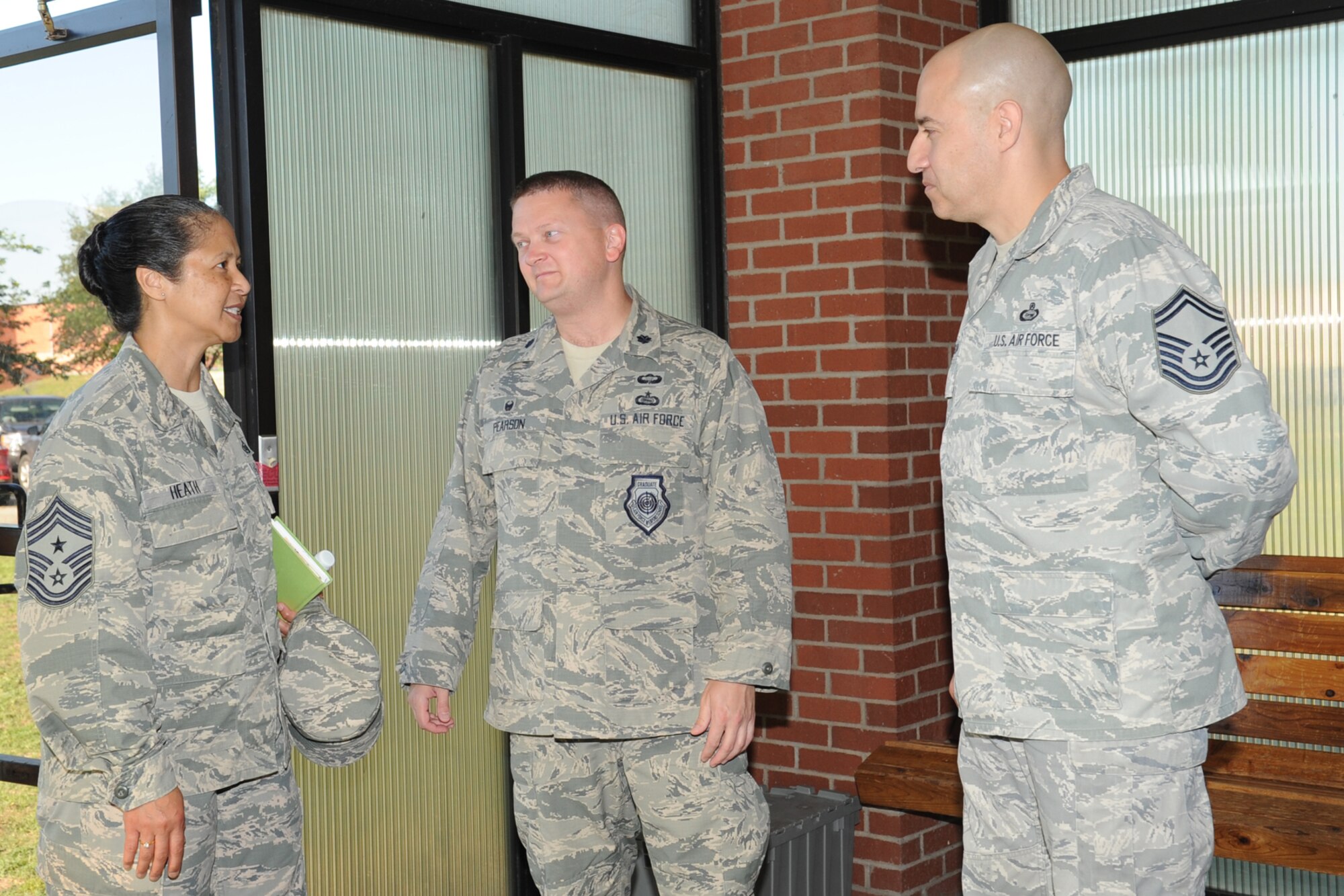 GOODFELLOW AIR FORCE BASE, Texas -- Chief Master Sgt. Arleen K. Heath, Air Force Intelligence, Surveillance and Reconnaissance Command Chief, talks with Lt. Col. Max E. Pearson, 316th Training Squadron Commander, and Senior Master Sgt. Scott M. Dickson, 316th TRS superintendent, before touring the squadron here June 3. Heath also toured the 312th and 315th Training Squadrons. (U.S. Air Force photo/ Staff Sgt. Laura R. McFarlane)