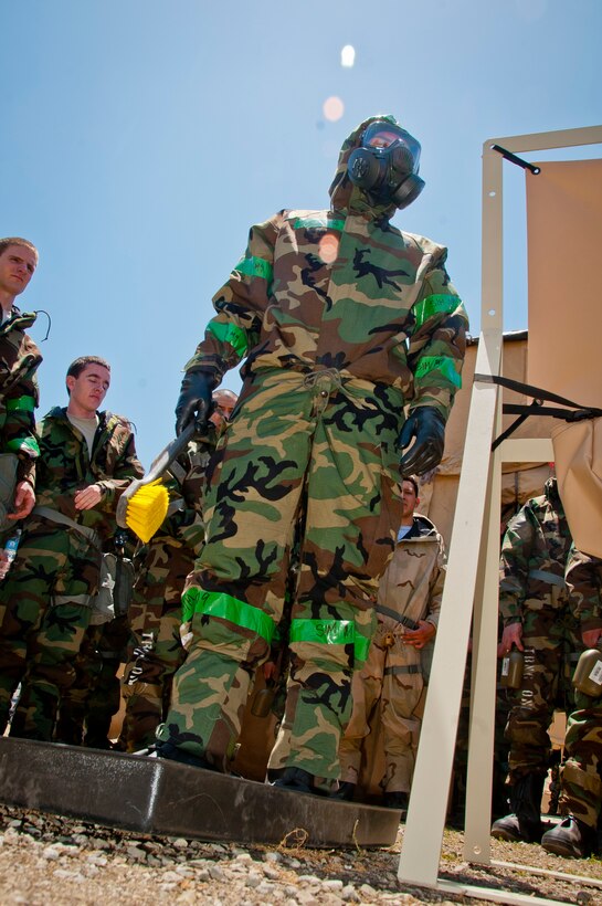 California Air National Guardsmen from the 129th Rescue Wing participate in War Skills Training at Moffett Federal Airfield, Calif., June 7, 2014.  The hands-on training provides airmen the opportunity to react to various Air Expeditionary Force and emergent mission tasking scenarios, including cover and concealment, and self-aid and buddy care. (U.S. Air National Guard photo by Senior Airman Rachael Kane/Released)