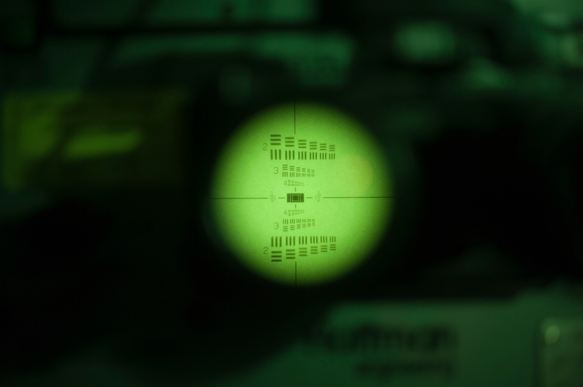 A 436th Operations Support Squadron aircrew flight equipment technician calibrates night vision goggles by sight June 9, 2014, at Dover Air Force Base, Del. NVGs are inspected every 180 days to ensure accuracy and compliance with technical orders. (U.S. Air Force photo/Senior Airman Jared Duhon) 