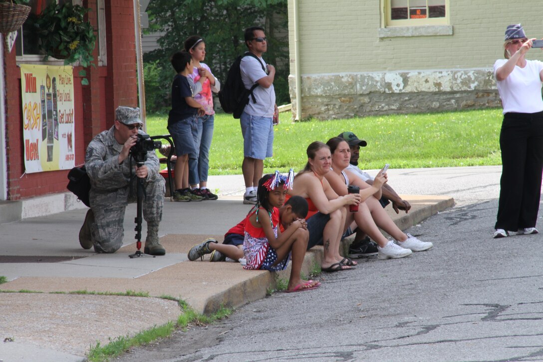 Covering the volunteers who helped at the Memorial Day parade public event from a variety of angles is Tech. Sgt. Christopher Parr, public affairs specialist and noncommissioned officer in charge.  He is a traditional PA reservist and enjoys attending the monthly unit training assembly to tell the story of the wing's Airmen.  He will be teaching classes on writing and photography in future weekends.  (U.S. Air Force photo/Maj. Stan Paregien) 