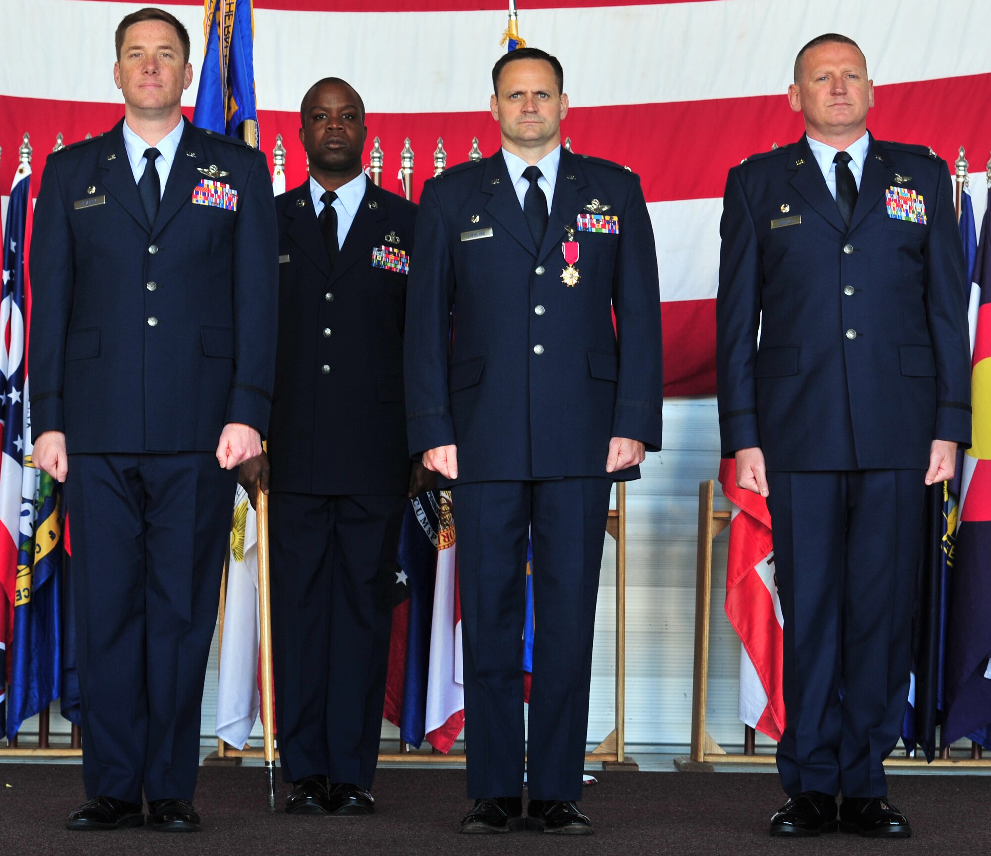 Col. Kieran Denehan takes the reins as commander of the 5th Operations Group from Col. Todd Copeland during a change of command ceremony at Minot Air Force Base, N.D., June 6, 2014. The 5th OG is the backbone of the 5th Bomb Wing, providing the aircrews who fly the wing’s B-52H Stratofortress. (U.S. Air Force photo/Senior Airman Andrew Crawford)
