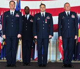 Col. Kieran Denehan takes the reins as commander of the 5th Operations Group from Col. Todd Copeland during a change of command ceremony at Minot Air Force Base, N.D., June 6, 2014. The 5th OG is the backbone of the 5th Bomb Wing, providing the aircrews who fly the wing’s B-52H Stratofortress. (U.S. Air Force photo/Senior Airman Andrew Crawford)
