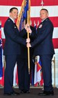Col. Kieran Denehan takes the reins as commander of the 5th Operations Group from Col. Todd Copeland during a change of command ceremony at Minot Air Force Base, N.D., June 6, 2014. The 5th OG is the backbone of the 5th Bomb Wing, providing the aircrews who fly the wing’s B-52H Stratofortress. (U.S. Air Force photo/Senior Airman Andrew Crawford)