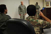 Tech. Sgts. Alex Chapa and Michael Pendleton from the 343th Training Squadron address students enrolled in the Integrated Defense Command and Control course at Joint Base San Antonio-Lackland. Foreign students from the International Military Student office program choose to enroll in up to 37 different technical training courses throughout the JBSA locations. The students from the IMS office program placed high English comprehension levels to be integrated in classrooms with Airmen. (U.S. Air Force photo by Airman Justine K. Rho/ released)