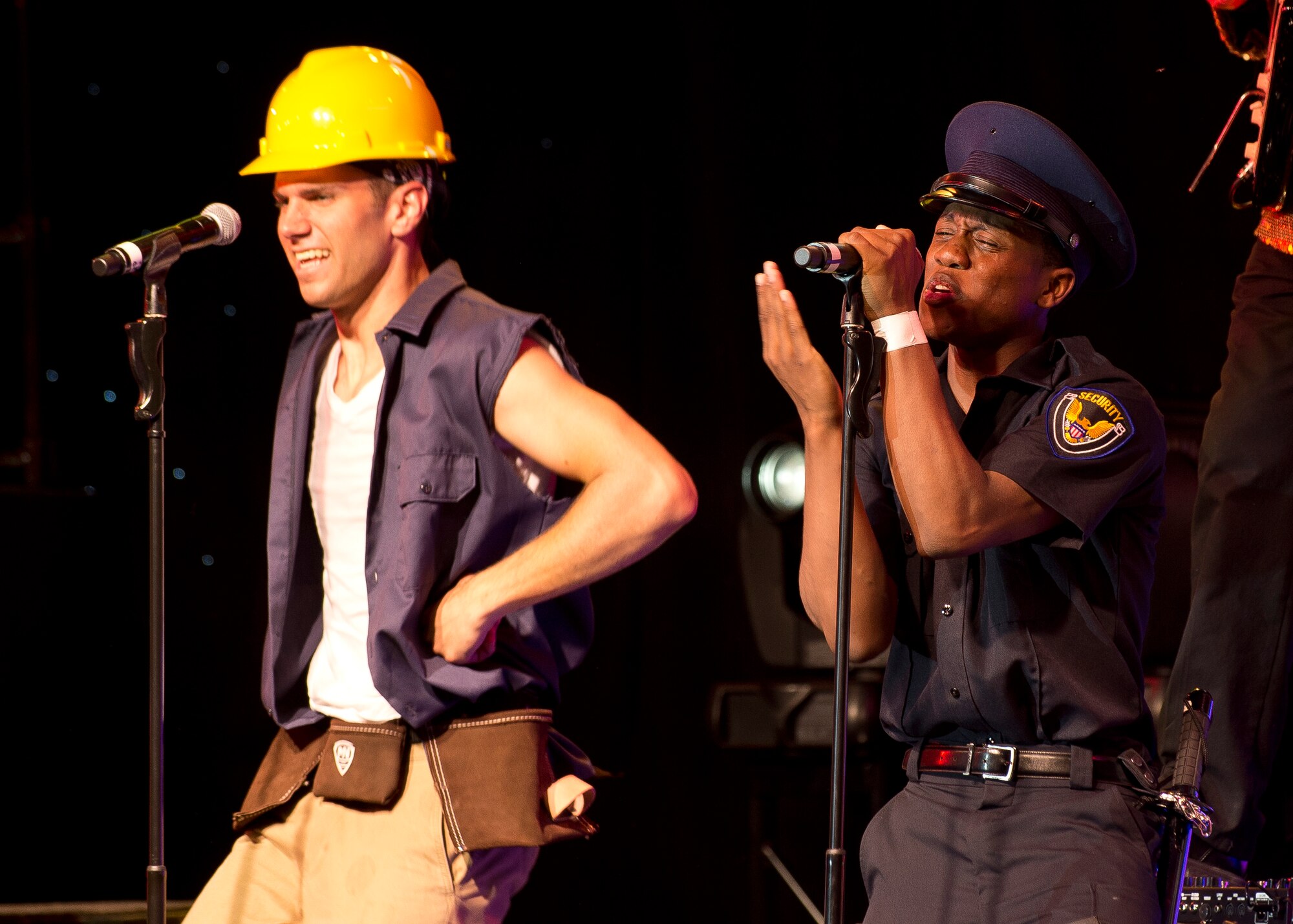 Village People classic "Y.M.C.A." performed by Tops in Blue. (U.S. Air Force photo by Ethan Wagner)