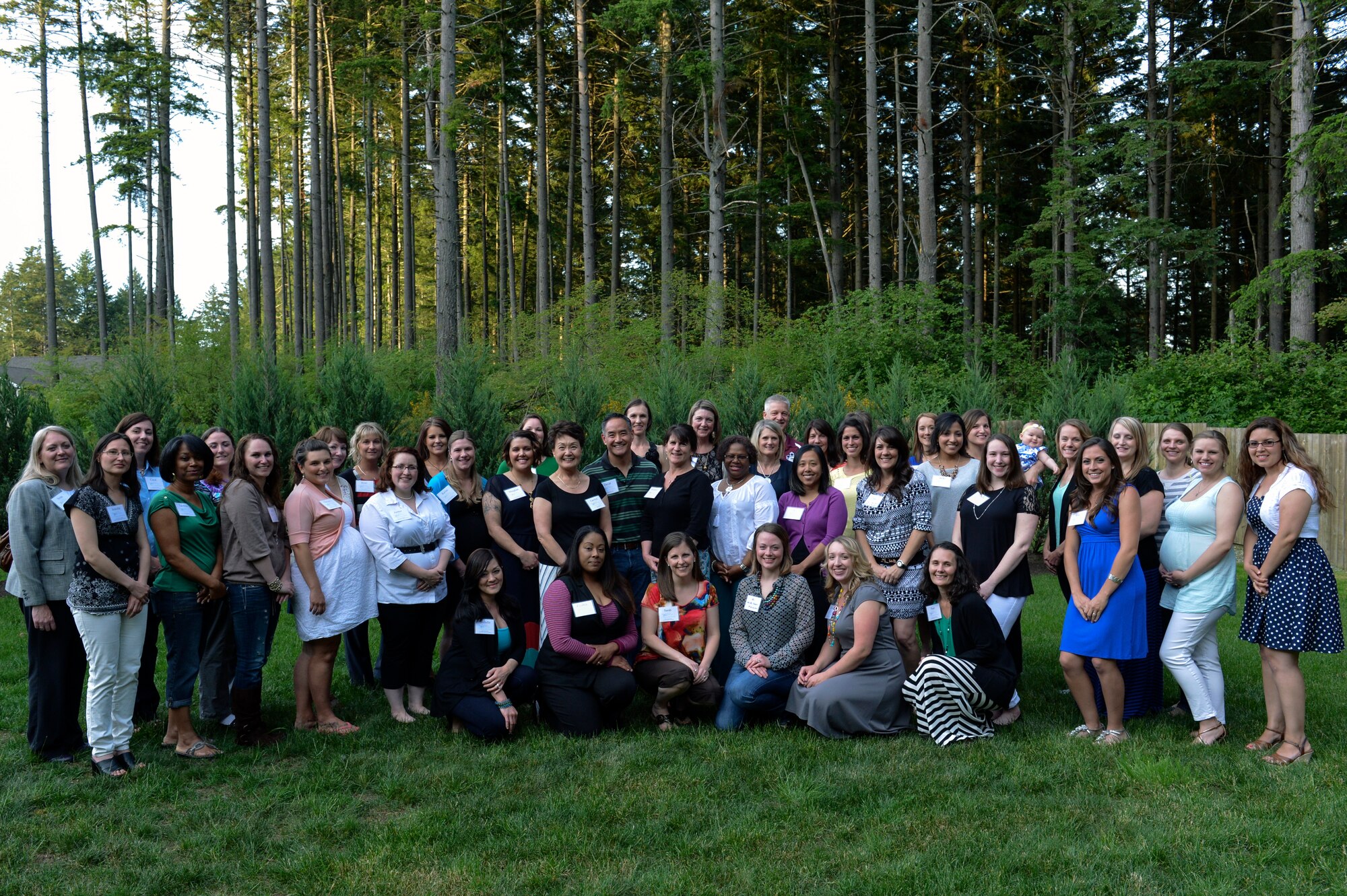 Col. David Kumashiro, 62nd Airlift Wing commander shows his gratitude to McChord’s key spouses during his Key Spouse Appreciation Evening June 5, 2014, at Joint Base Lewis-McChord, Wash.  Just before the group dispersed, Kumashiro jumped out in order to take a selfie photo of his own. (U.S. Air Force photo/Staff Sgt. Russ Jackson)