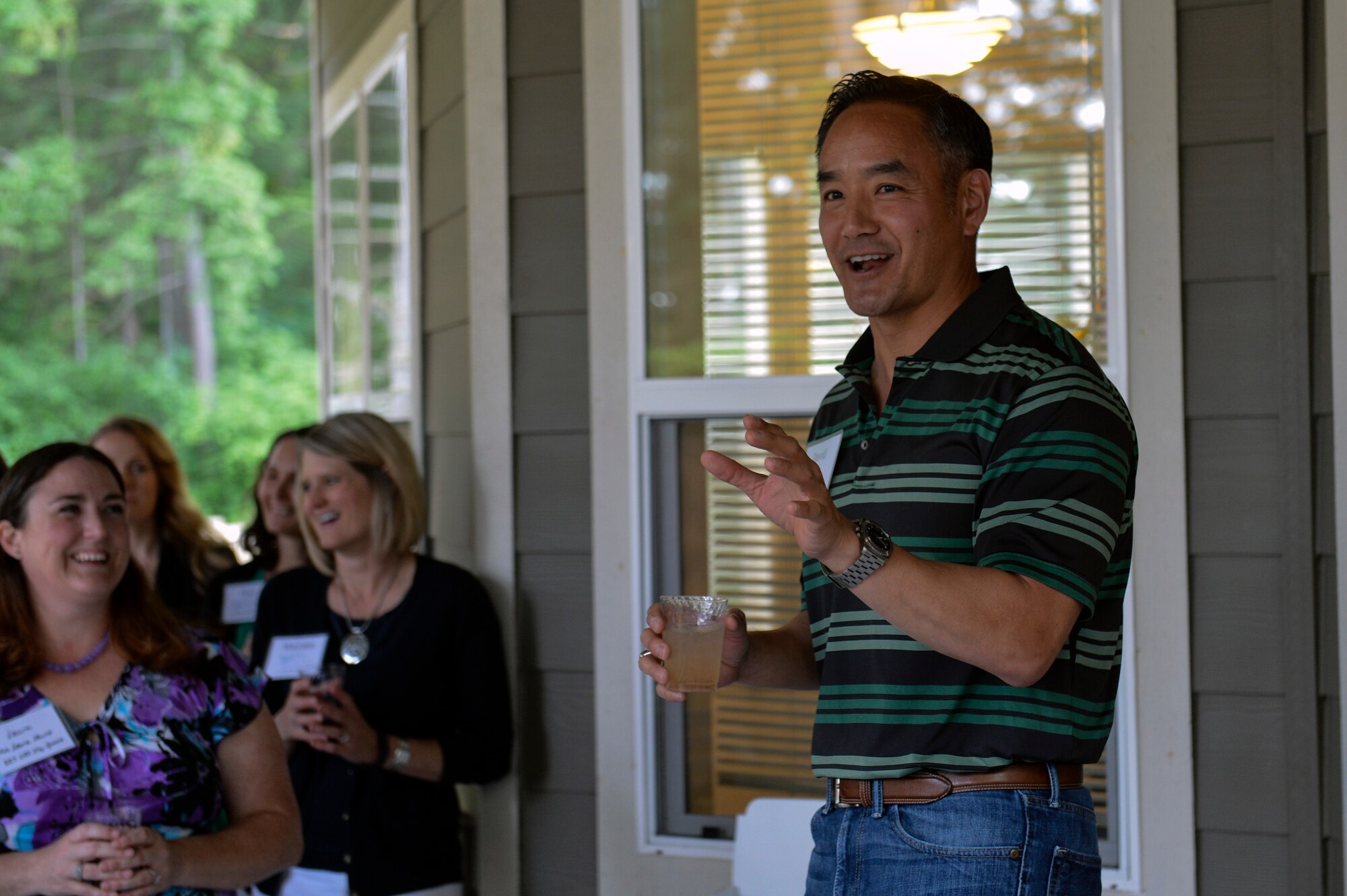 Col. David Kumashiro, 62nd Airlift Wing commander, takes a moment to thank the key spouses for attending his Key Spouse Appreciation Evening June 5, 2014, at Joint Base Lewis-McChord, Wash. Kumashiro praised McChord’s key spouses for all their support to Air Force service members by hosting them to a casual party at his home. (U.S. Air Force photo/Staff Sgt. Russ Jackson)