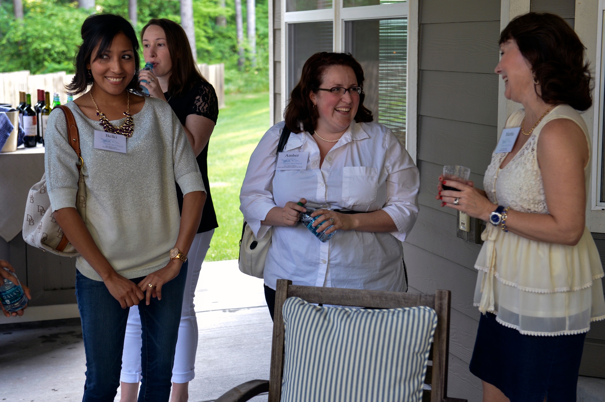 Belki Padilla (left), Amber O’Brien (center), and Martha Drake (right), key spouses from the 7th Airlift Squadron, the 627th Logistics Readiness Squadron and the 62nd Airlift Wing, respectively, enjoy catching up with each other during the Key Spouse Appreciation Evening  hosted by Col. David Kumashiro, 62nd Airlift Wing commander June 5, 2014, at Joint Base Lewis-McChord, Wash. Kumashiro invited McChord’s key spouses to his home for light hors d’oeuvres to thank them for all they do for the Air Force. (U.S. Air Force photo/Staff Sgt. Russ Jackson)