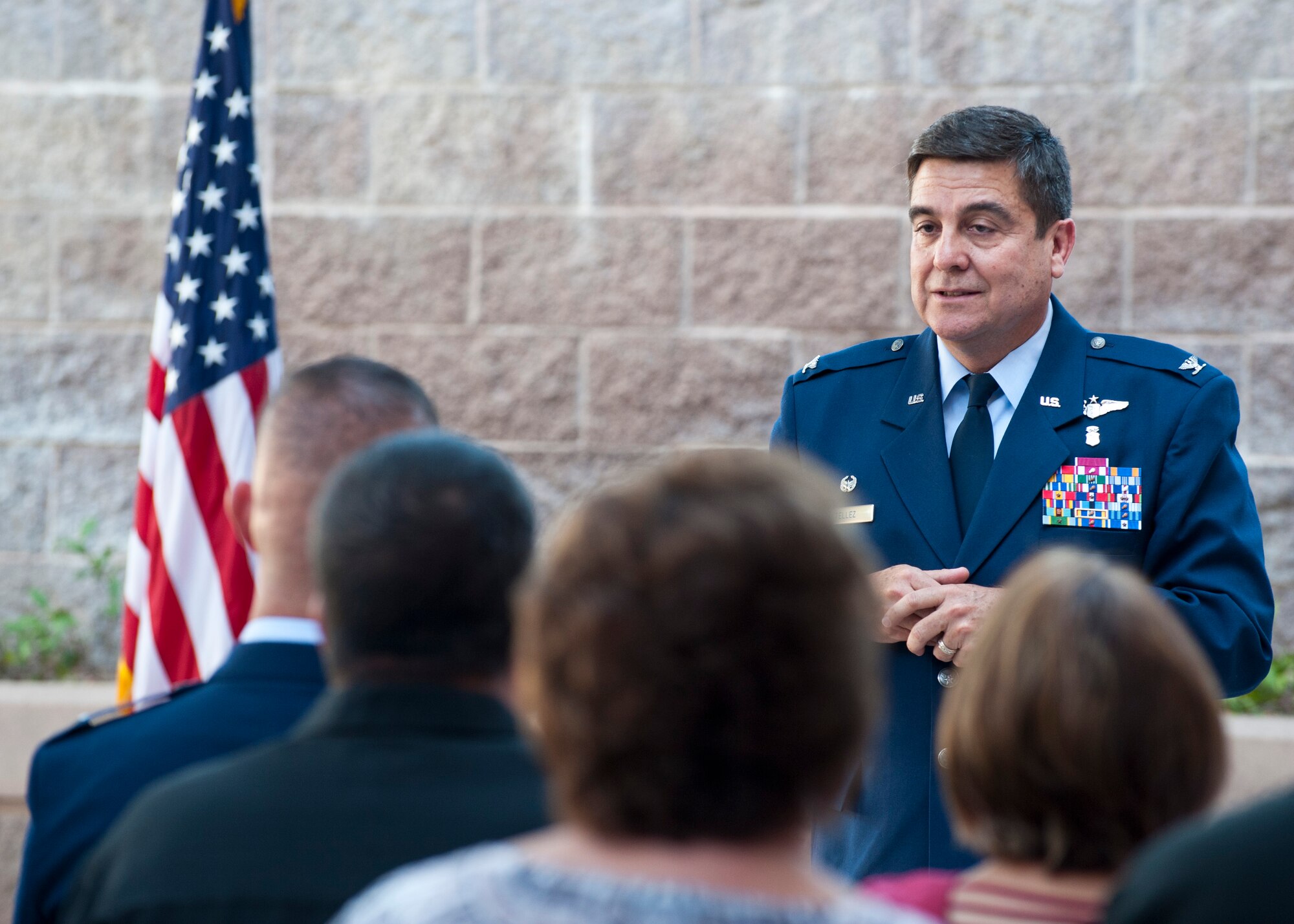 U.S. Air Force Col. Guillermo Tellez, 99th Medical Group commander, delivers closing remarks at the Interservice Physician Assistant Program graduation at the Mike O’Callaghan Federal Medical Center, June 6, 2014, at Nellis Air Force Base, Nev. The IPAP consists of two phases. The first phase provides 64 weeks of classroom and labratory instruction for the student during which they receive over 100 college credit hours. The second phase consists of clinical training lasting 52 weeks and more than 2500 hours of clinical experience. (U.S. Air Force photo by Airman 1st Class Thomas Spangler)  