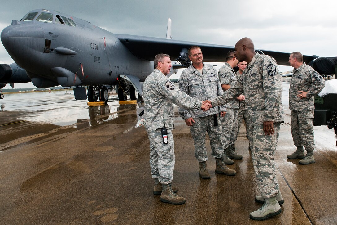 U.S. Air Force Reserve Command Chief Master Sgt. Cameron Kirksey thanks Master Sgt. David Smith, 307th Aircraft Maintenance Squadron crew chief, after being given a tour of a B-52H Stratofortress, June 8, 2014, Barksdale Air Force Base, La. Kirksey visited the 307th Bomb Wing where he toured the different work areas to talk with Airmen. (U.S. Air Force photo by Master Sgt. Greg Steele/Released)
