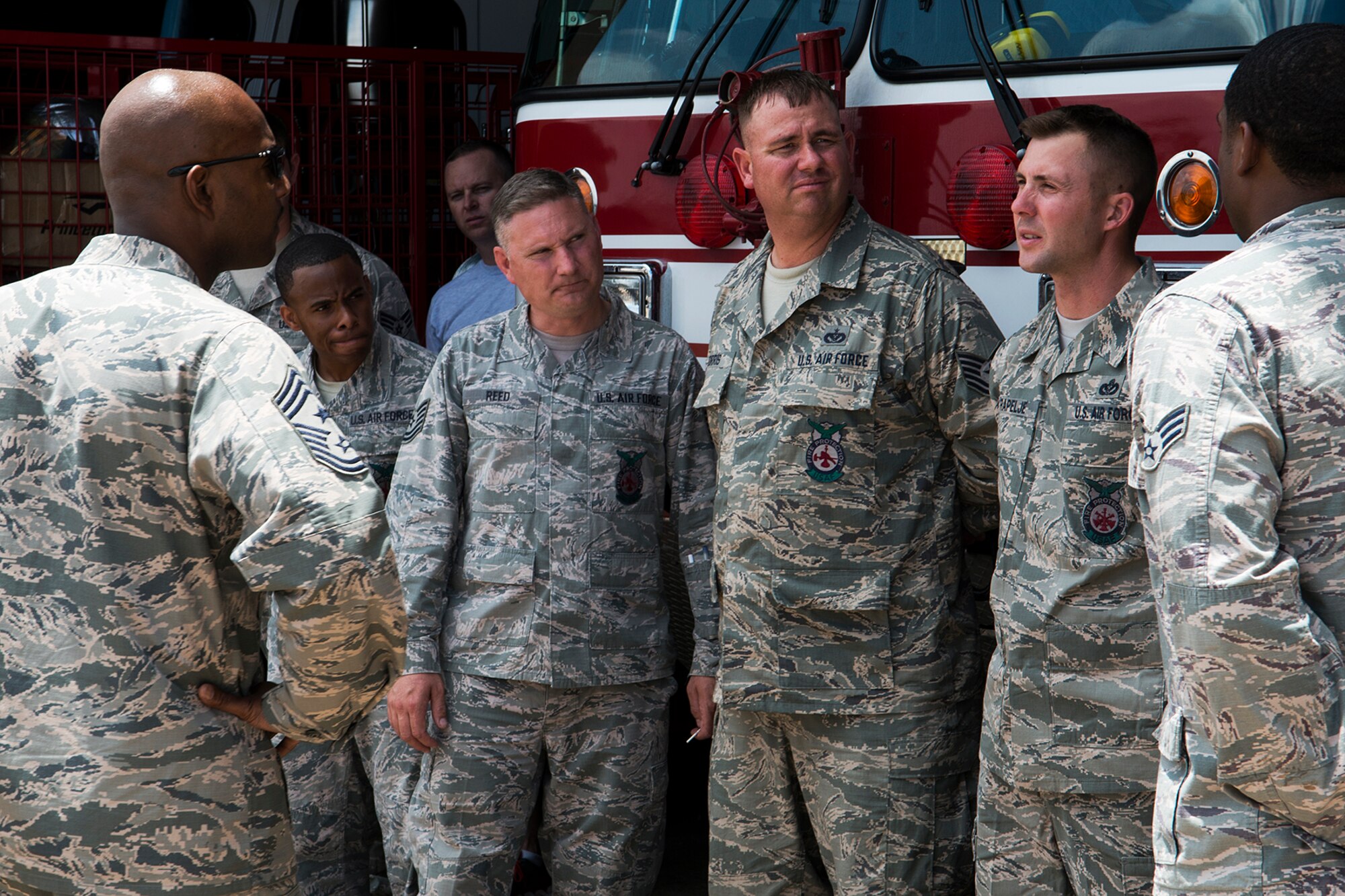 U.S. Air Force Reserve Command Chief Master Sgt. Cameron Kirksey visits with a group of 307th Civil Engineering Squadron Firefighters and is asked a question by Master Sgt. Jonathan Rapelje, June 8, 2014, Barksdale Air Force Base, La. Kirksey visited with Airmen assigned to the 307th Bomb Wing to talk about matters concerning them and Air Force Reserve. (U.S. Air Force photo by Master Sgt. Greg Steele/Released)