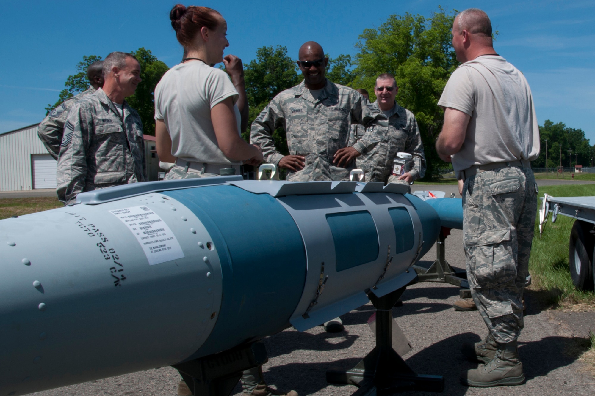 U.S. Air Force Reserve Command Chief Master Sgt. Cameron Kirksey looks over munitions being prepared by Airmen of the 307th Bomb Wing during his visit to Barksdale Air Force Base, La. June 7, 2014. Kirksey spent the entire unit training assembly with various units of the 307th Bomb Wing, listening to questions and addressing their concerns. (U.S. Air Force photo by Tech. Sgt. Ted Daigle/Released)