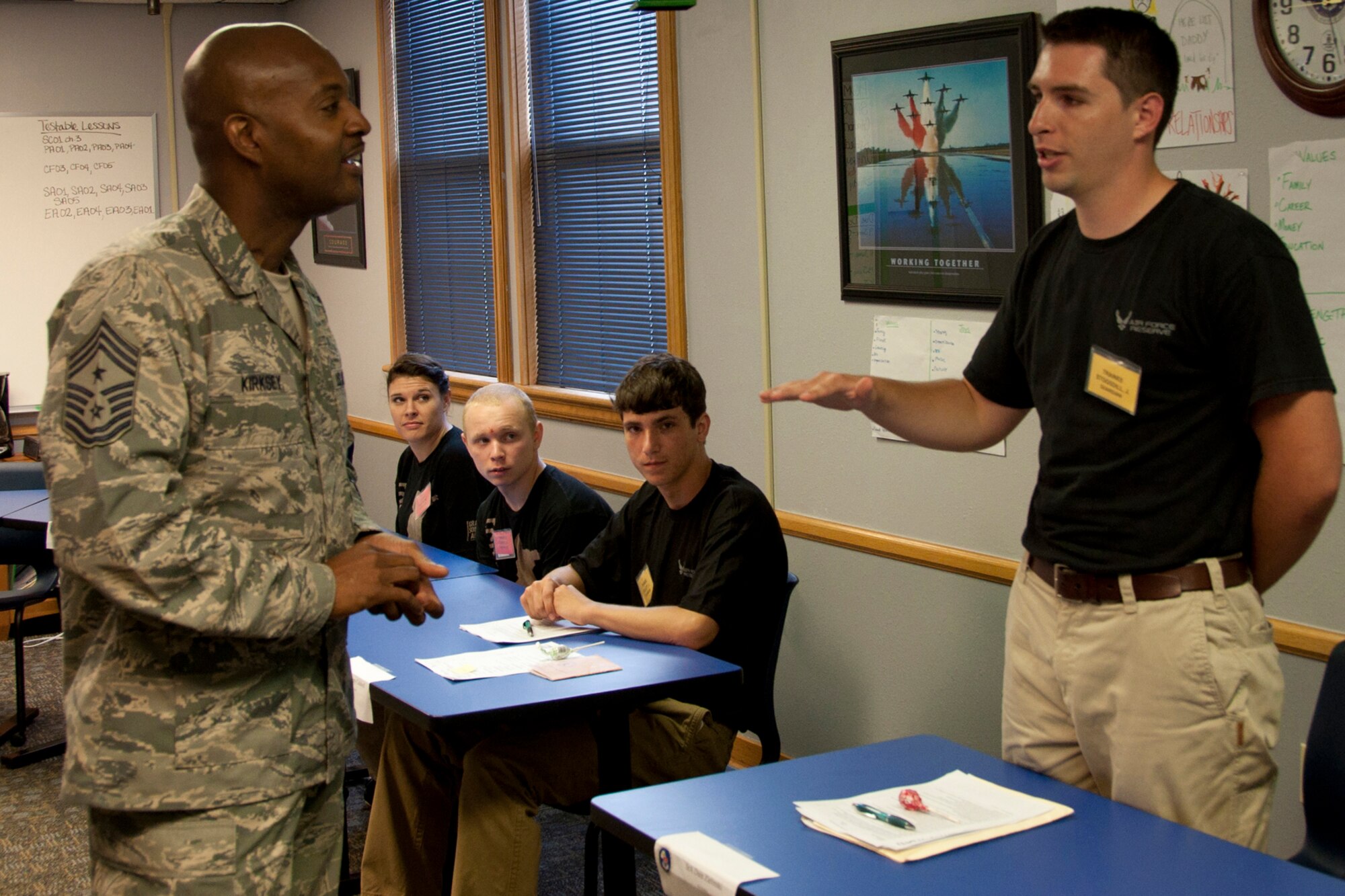 U.S. Air Force Reserve Command Chief Master Sgt. Cameron Kirksey listens as Jackson Stogsdill, a recruit with the 307th Bomb Wing Delayed Entry Training Flight (DTF), answers a question about leadership, June 7, 2014, Barksdale Air Force Base, La. The goal of the DTS is to ready new recruits for the rigors of basic military training, and Kirksey reinforced that they are the next generation of warriors who have volunteered to defend their country. (U.S. Air Force photo by Tech. Sgt. Ted Daigle/Released)