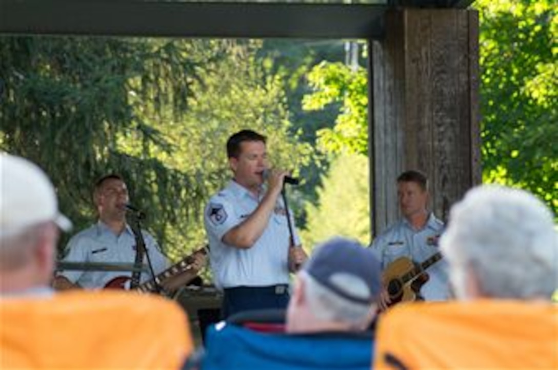 Our band's Superintendent, Senior Master Sergeant Brent Whitaker, sings with Space A, our small rock band