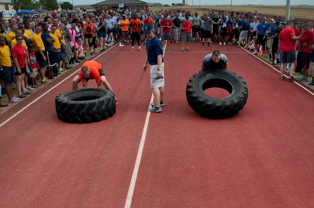 Airmen, Soldiers and Sailors celebrated Armed Forces Day at Sheppard Air Force Base, Texas, by participating in the 9th annual Joint Warrior Challenge, June 7, 2014, at the base one-mile track. The challenge itself consisted of five physically demanding events that pushed each 10 member team to their limits. The 363rd Training Squadron came out on top of the other 16 teams, scoring in the top two of every event. (U.S. Air Force photo/Airman 1st Class Robert L. McIlrath)