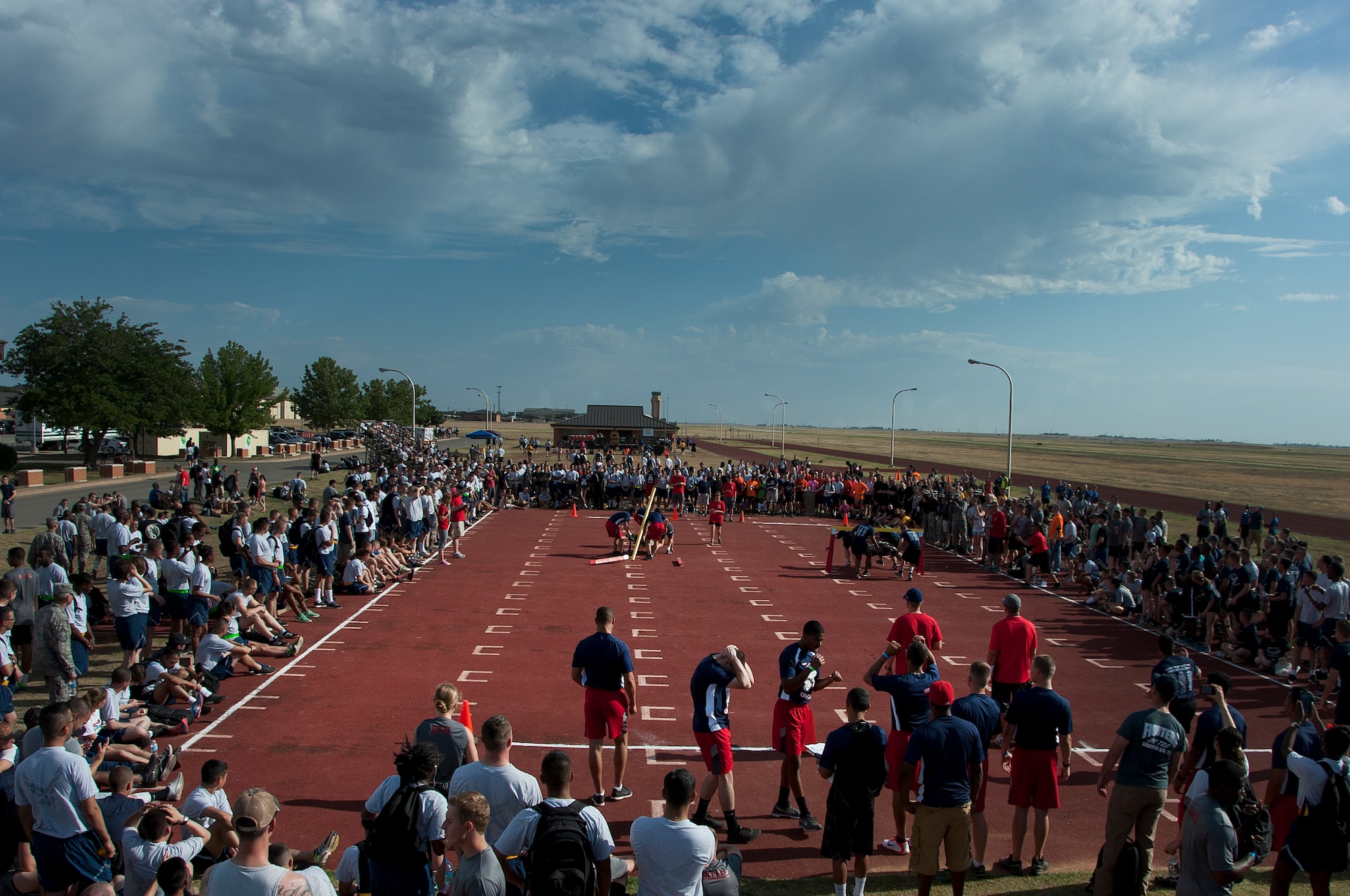 Airmen, Soldiers and Sailors celebrated Armed Forces Day at Sheppard Air Force Base, Texas, by participating in the 9th annual Joint Warrior Challenge, June 7, 2014, at the base one-mile track. The challenge itself consisted of five physically demanding events that pushed each 10 member team to their limits. The 363rd Training Squadron came out on top of the other 16 teams, scoring in the top two of every event. (U.S. Air Force photo/Airman 1st Class Robert L. McIlrath)