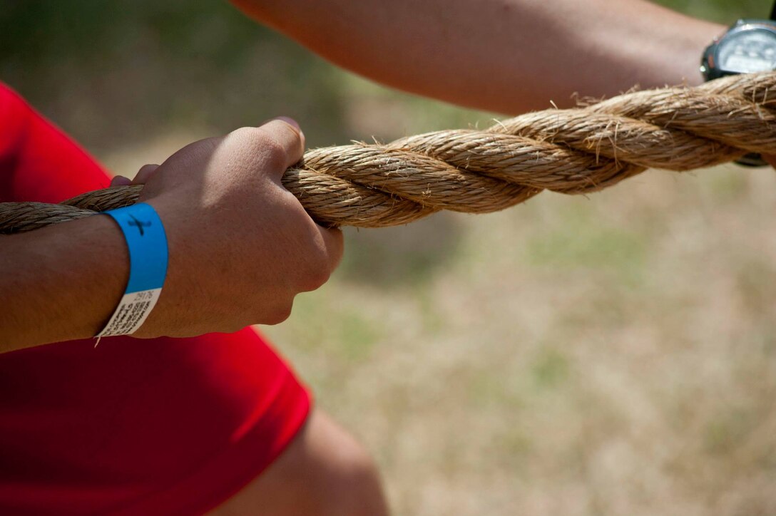 Airmen, Soldiers and Sailors celebrated Armed Forces Day at Sheppard Air Force Base, Texas, by participating in the 9th annual Joint Warrior Challenge, June 7, 2014, at the base one-mile track. The challenge itself consisted of five physically demanding events that pushed each 10 member team to their limits. The 363rd Training Squadron came out on top of the other 16 teams, scoring in the top two of every event. (U.S. Air Force photo/Airman 1st Class Jelani Gibson)