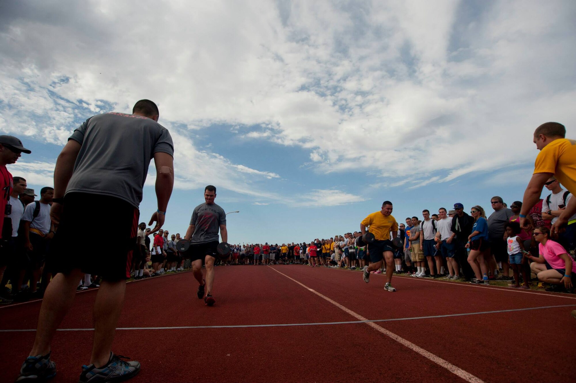 Airmen, Soldiers and Sailors celebrated Armed Forces Day at Sheppard Air Force Base, Texas, by participating in the 9th annual Joint Warrior Challenge, June 7, 2014, at the base one-mile track. The challenge itself consisted of five physically demanding events that pushed each 10 member team to their limits. The 363rd Training Squadron came out on top of the other 16 teams, scoring in the top two of every event. (U.S. Air Force photo/Airman 1st Class Jelani Gibson)