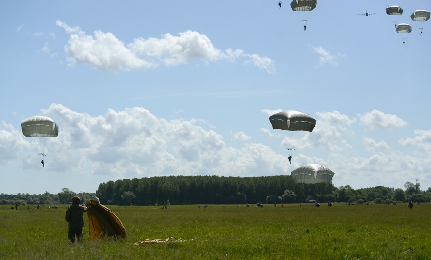 Paratroopers land on the Iron Mike Drop Zone outside St. Mere Eglise, France during the 70th anniversary celebration of D-Day June 8, 2014. The jumps commemorated the 70th anniversary of Operation Overlord, the D-Day invasion of World War II. (U.S. Air Force photo/Airman 1st Class Dillon Johnston/Released)
