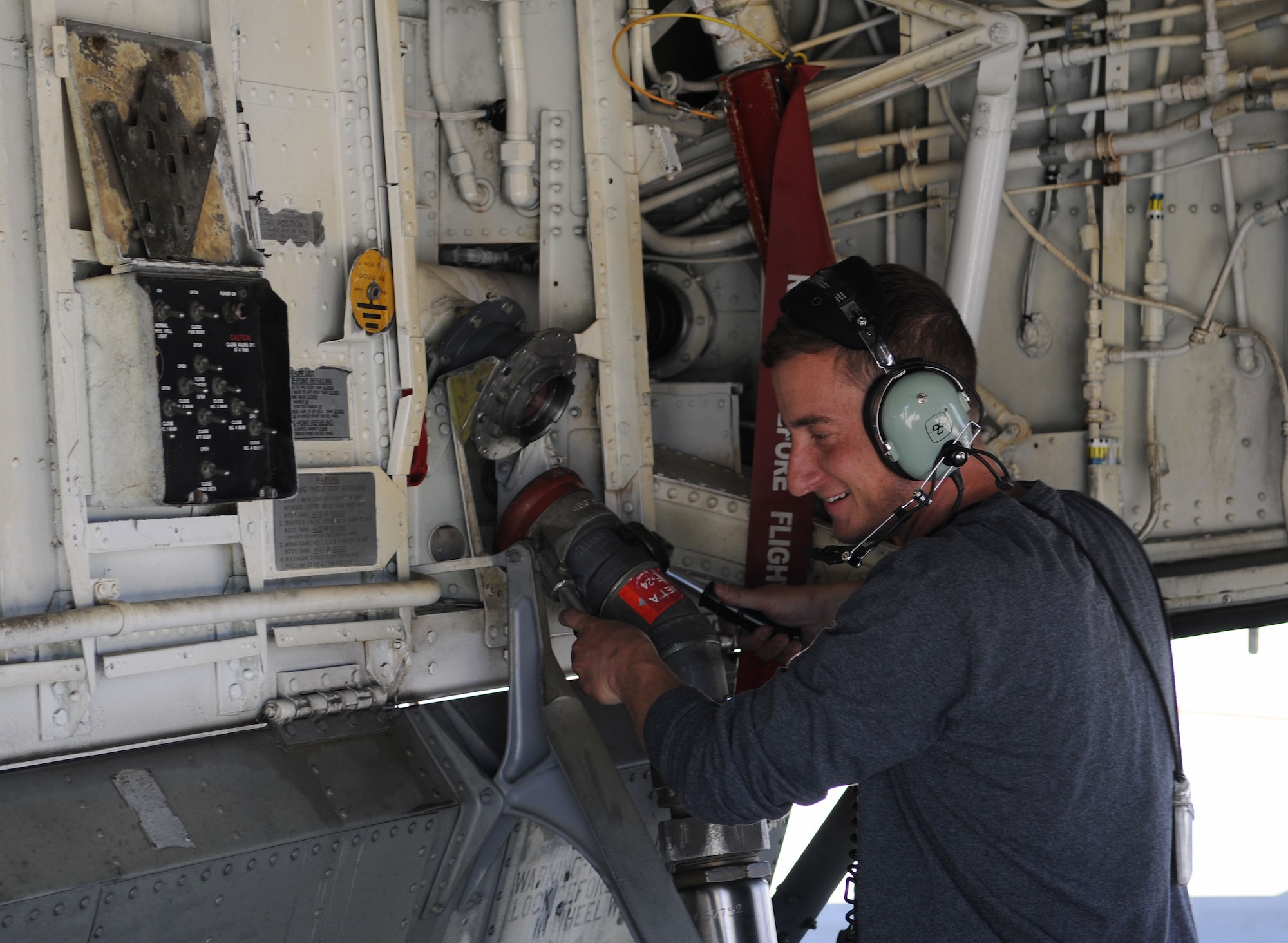 Michael Rausch, a 459th Air Refueling Wing KC-135 Stratotanker crew chief, removes the fuel hose after refueling the KC-135 with JET A on Joint Base Andrews, Md., June 6, 2014. (U.S. Air Force photo/Airman 1st Class Ryan J. Sonnier)