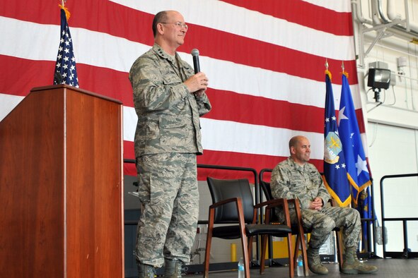 YOUNGSTOWN AIR RESERVE STATION, Ohio – Air Force Reserve Commander Lt. Gen. James J. Jackson listens to a question from one of the Citizen Airmen of the Air Force Reserve’s 910th Airlift Wing as Col. James Dignan, 910th Airlift Wing commander, looks on during an Air Force Reserve Commander’s Call in a hangar here, June 7, 2014. General Jackson addressed the wing and answered questions in a town hall-style session as part of his visit to the installation to take a firsthand look at the 910th’s airlift capability, aerial spray mission and the air station’s facilities as well as future requirements. U.S. Air Force photo by Senior Airman Rachel Kocin.