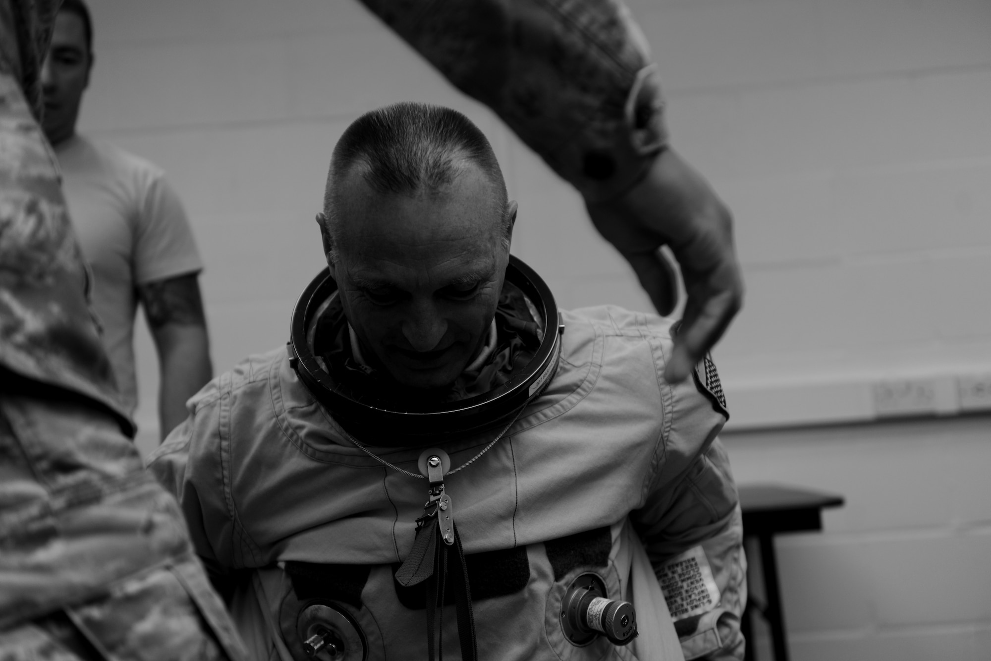 U.S. Air Force Maj. Cory Bartholomew, U-2 Dragon Lady pilot from the 9th Reconnaissance Wing, slips on his specially-designed pressure suit at RAF Fairford, United Kingdom, June 6, 2014. The suit is worn to help U-2 pilots handle the high-altitude flights with minimal physical impact. (U.S. Air Force photo by Staff Sgt. Jarad A. Denton/Released)