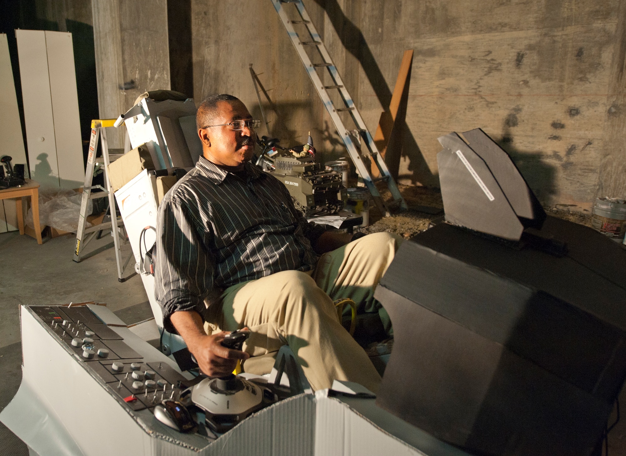 David Gatling of Newport News, Va., used an old entertainment center to build the ejection seat of his “green” F-16 simulator. The simulator is made entirely from recycled and reclaimed materials and is fully functional. (U.S. Air Force photo by Melissa Walther/Released)