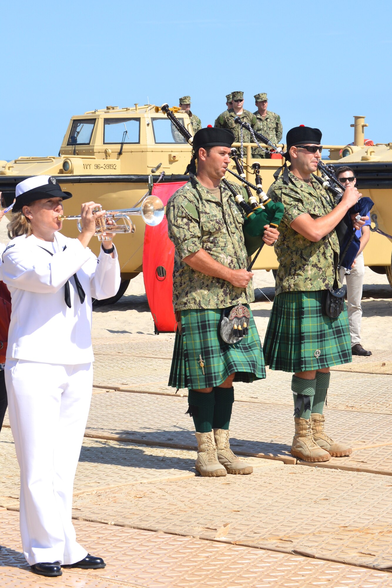 U.S. Navy Sailors play bagpipes during the 70th Anniversary D-Day Remembrance Ceremony at Joint Expeditionary Base Little Creek-Fort Story, Va., June 6, 2014. The ceremony also included an amphibious assault demonstration by the Navy, where Soldiers stormed the beach in reenactment. (U.S. Army photo by Spc. Marian Alleva/Released) 