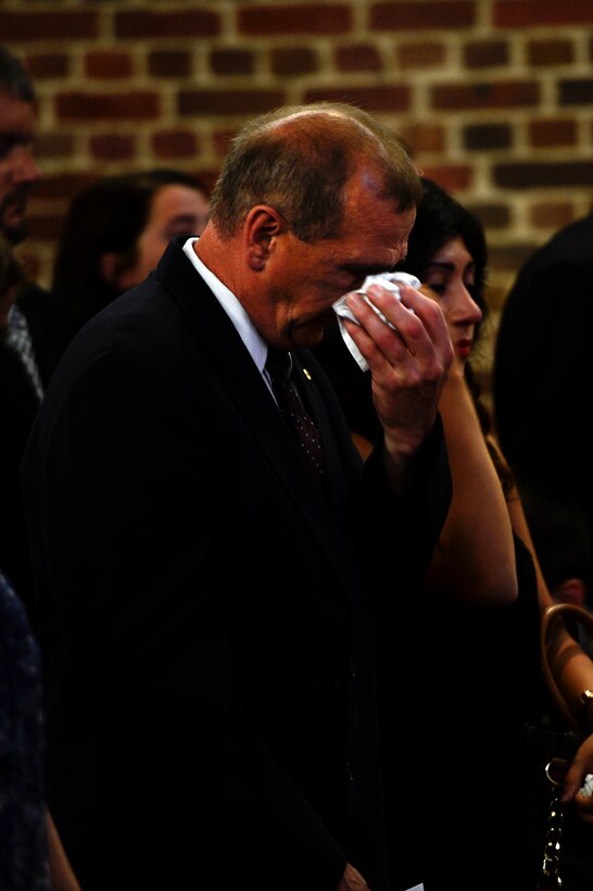 Richard Malone mourns the passing of his son, U.S. Air Force Senior Airman Dennis Malone, during a memorial ceremony at Langley Air Force Base, Va., June 6, 2014. Dennis Malone was a member of the 633rd Contracting Squadron and a native of Syracuse, N.Y. Malone was 28 years old when he died in a single-car accident in Hannibal, N.Y., May 25. (U.S. Air Force photo by Senior Airman Kayla Newman/Released)