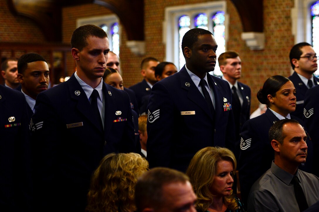 U.S. Air Force Airmen attend a memorial ceremony for Senior Airman Dennis Malone, 633rd Contracting Squadron contract administrator, at Langley Air Force Base, Va., June 6, 2014. Malone died in Hannibal, N.Y., May 25 in a single-vehicle accident. (U.S. Air Force photo by Senior Airman Kayla Newman/Released) 