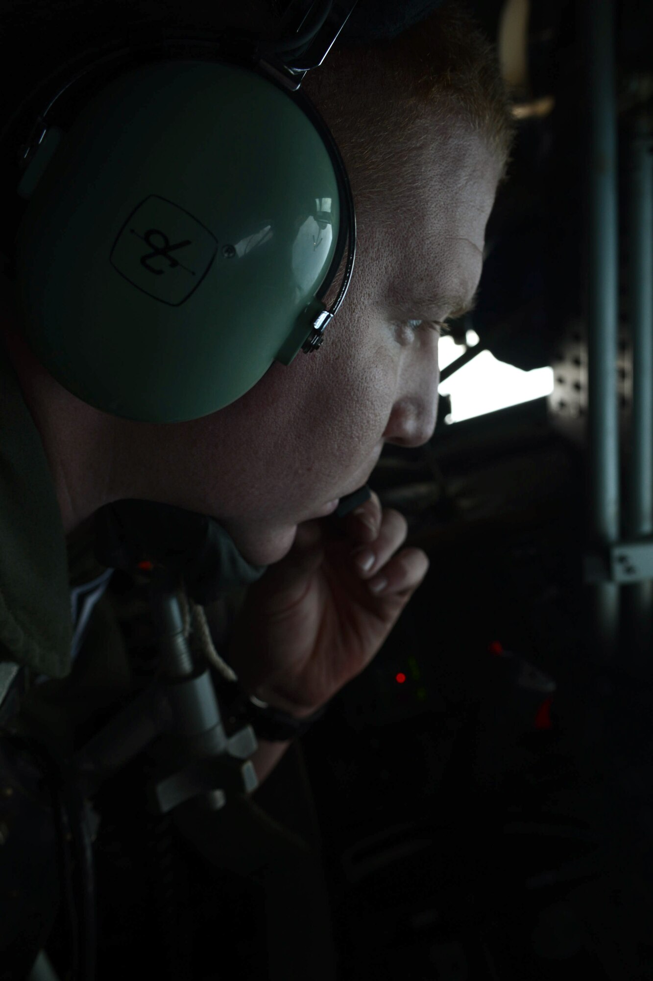 U.S. Air Force Staff Sgt. Mathew Ohle, 351st Expeditionary Air Refueling Squadron-Poland boom operator from Anchorage, Ala., talks to pilots while refueling an F-16 C/D Fighting Falcon June 9, 2014, over the Baltic Sea. This refueling was in support of the 2014 Baltic Operations Exercise. (U.S. Air Force photo/Airman 1st Class Kyla Gifford/Released)