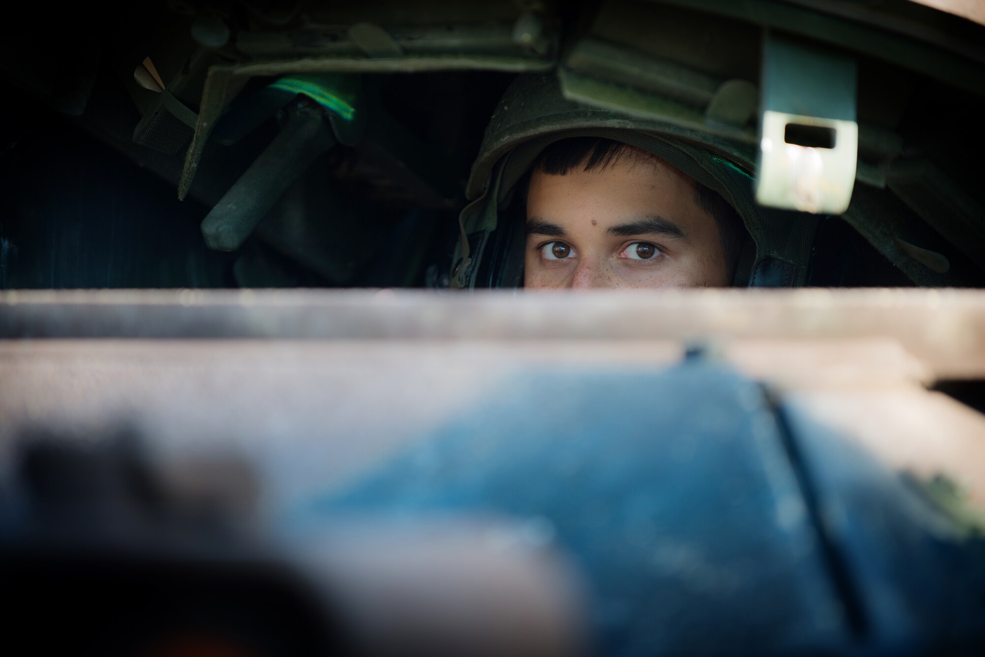 U.S. Army Spc. Brandon Bellingham, Bravo Company 2-5, drives a M2A3 Bradley Fighting Vehicle to be displayed in the Saber Strike kick-off ceremony at the Adazi training area, Latvia, June 9, 2014. Nations participating in Saber Strike include the Baltic Nations of Latvia, Lithuania and Estonia, as well as Canada, Denmark, Finland, Norway, the United Kingdom and the United States. The diverse allied nations gathered together with the goal to improve synchronized and prepared responses to regional security threats and missions. (U.S. Air Force photo/Senior Airman Jonathan Stefanko)participating nations and units to support multilateral contingency operations. (U.S. Air Force photo/Senior Airman Jonathan Stefanko)