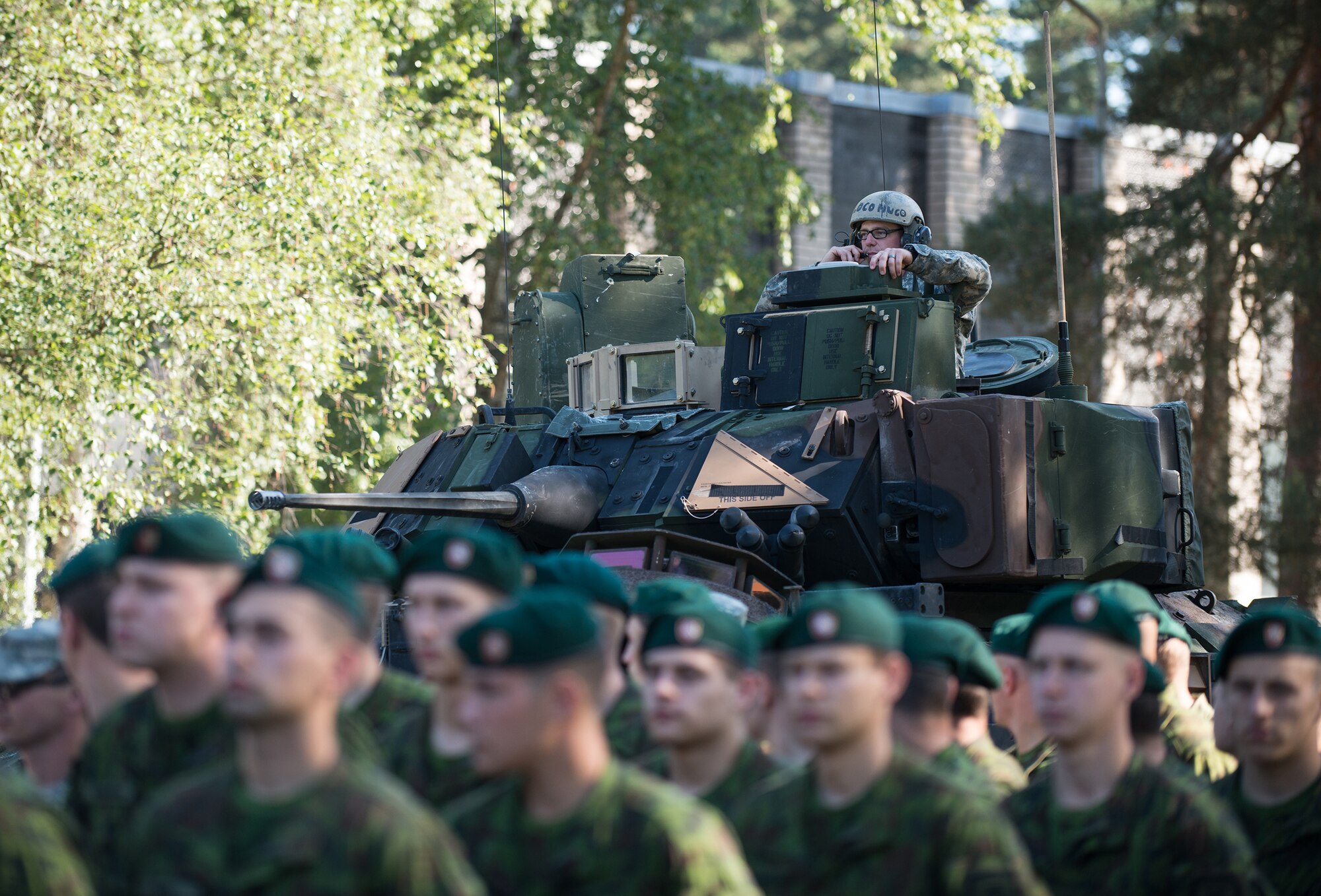 A U.S. Army M2A3 Bradley Fighting Vehicle drives by Lithuania military members to display in the Saber Strike kick-off ceremony at the Adazi training area, Latvia, June 9, 2014. Saber Strike is a longstanding, multilateral security cooperation exercise that is conducted at locations throughout the Baltic region. This year's objective is to facilitate cooperation amongst the United States, Lithuania, Latvia and Estonia to improve joint operational capability in a range of missions as well as prepare the
participating nations and units to support multilateral contingency operations. (U.S. Air Force photo/Senior Airman Jonathan Stefanko)