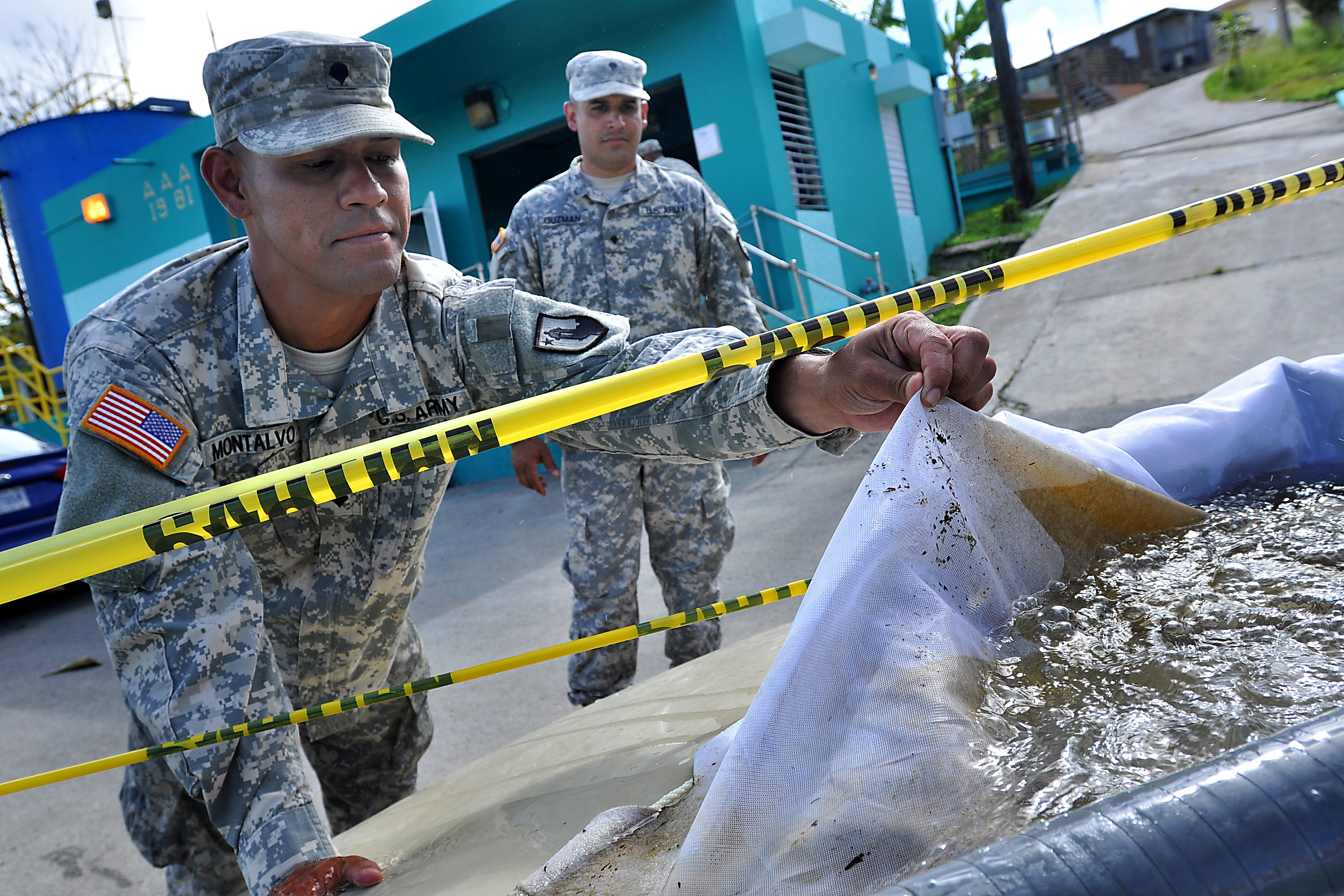 Army Spc Luis Montalvo Foreground Demonstrates How A Filter Catches Debris During Training To Purify Water