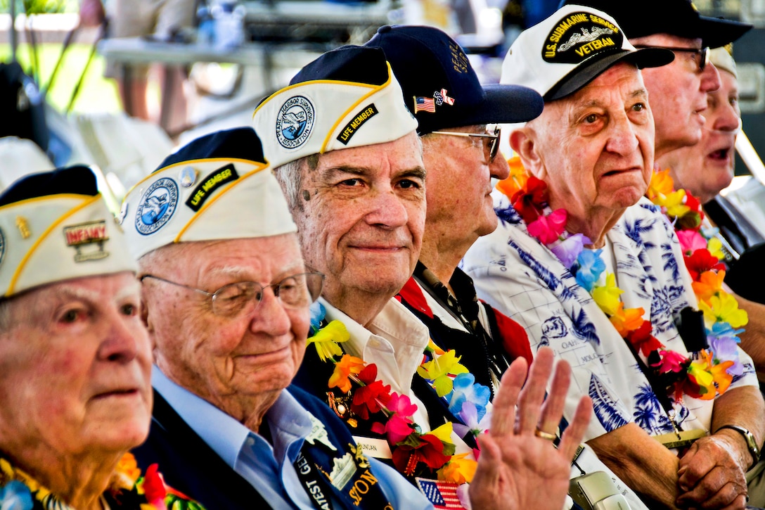 Pearl Harbor survivors observe as the U.S. Naval Sea Cadets Concert Band of the West perform at the Pearl Harbor Memorial Museum and Visitor Center during Kama'aina and military appreciation day at Pearl Harbor, Hawaii, Dec. 4, 2011. This year marks the 70th anniversary of the 1941 attacks on Pearl Harbor in which more than 2,400 people died.  
