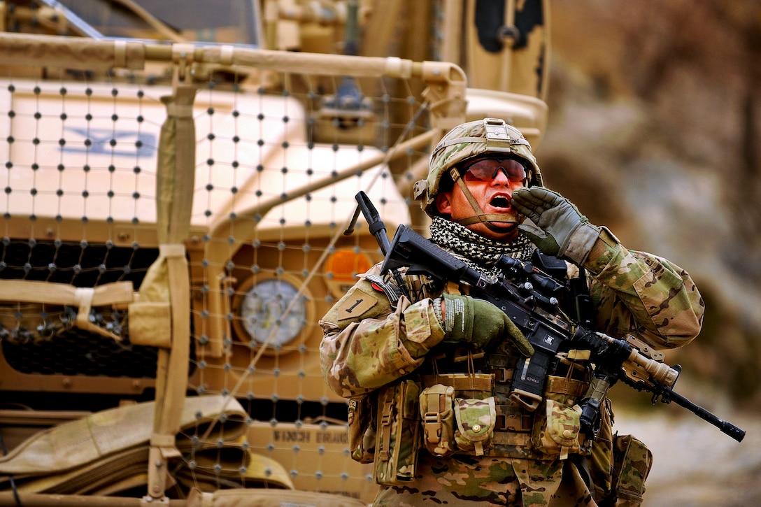 U.S. Army Staff Sgt, Mark Lynas calls for a member of his team during a mission in Shah Joy, Afghanistan, Nov. 26, 2011. Lynas, a squad leader assigned to Provincial Reconstruction Team Zabul, is deployed from Company C, 182nd Infantry Regiment, Massachusetts National Guard.  
