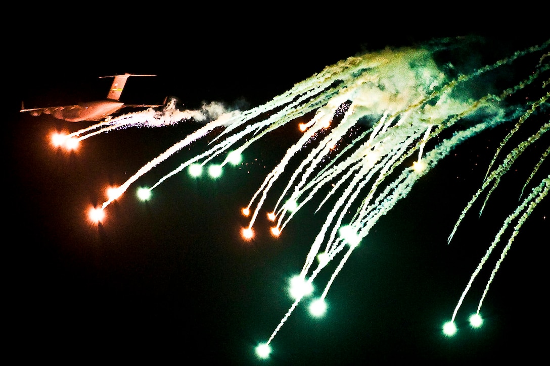 A C-17 Globemaster III performs evasive counter measures by launching flares during a mobility exercise over the Nevada Test and Training Range, Nov. 16, 2011. The U.S. Air Force Weapons School holds mobility air exercises twice a year to test the ability of C-17A Globemaster III and C-130 Hercules aircrews from U.S. Air Force bases around the world.  
