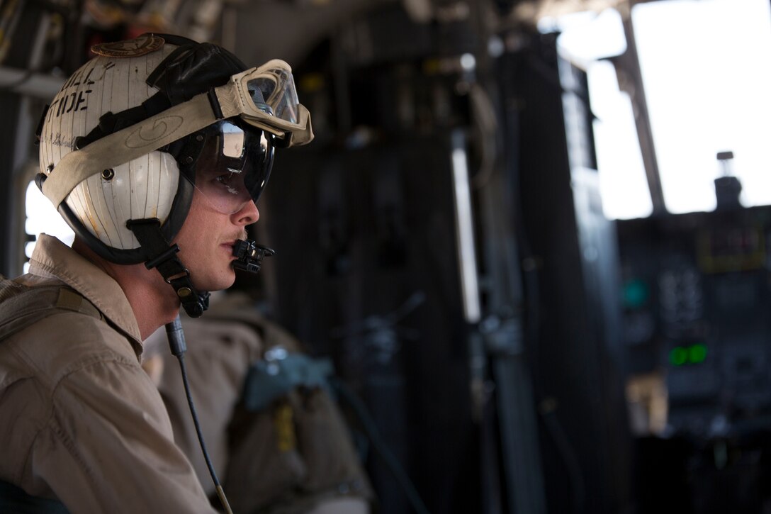 Staff Sgt. Paul Wood, a CH-46E Sea Knight helicopter crew chief with Marine Medium Helicopter Squadron 774, 4th Marine Aircraft Wing, Marine Forces Reserve, sits in the helicopter as it prepares to take off during an area familiarization flight as part of Integrated Training Exercise 4-14 here June 7, 2014. The flight was the first flight operation during the two-week exercise and the first time the pilots had flown in a desert environment since last year’s ITX. ITX is the largest Marine Corps Reserve training exercise with more than 4,000 Marines and sailors participating from units across the United States. The exercise focuses on the tactical application of combined-arms during global contingencies.