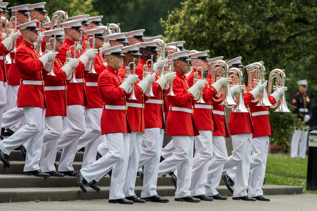 The United States Marine Drum & Bugle Corps performs during a Tuesday Sunset Parade at the Marine Corps War Memorial in Arlington, Va., June 10. (Official Marine Corps photo by Cpl. Larry Babilya/Released)