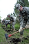 North Dakota National Guard Members dig a fire line during wildland firefighting training at the 119th Wing's Regional Training Site in Fargo, N.D., May 6, 2012. The training certified Guard members to fight wildfires and allows them to assist local and state officials should a wildfire situation occur.