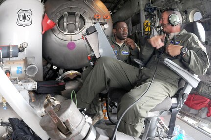 Air Force Chief Master Sgt. Andy Huneycutt, right, a loadmaster supervisor, and Master Sgt. Jermaine Parker, a loadmaster with the 156th Airlift Squadron, North Carolina Air National Guard, discuss operation of the Modular Airborne Fire Fighting System II before taking part in a wildfire suppression training mission, near Greenville, S.C., May 7, 2012. The North Carolina Air Guard and the U.S. Forest Service used the opportunity to train together in order to better be prepared for the upcoming wildland fire season. The squadron is one of four units in the Air Guard and Air Force Reserve trained to conduct the MAFFS mission.