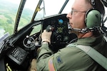 Air Force Col. Roger Williams Jr., an instructor pilot with the 156th Airlift Squadron, North Carolina Air National Guard, skirts above the treetops at about 150 feet in a C-130 Hercules aircraft as he locks in on a U.S. Forest Service lead plane during wildland fire suppression training mission in Pisgah National Forest, N.C., May 9, 2012. The aircraft Williams flew was equipped with the Modular Airborne Fire Fighting System II, a tanking system that can hold up to 3,000 gallons of retardant or water used to create firebreaks during aerial wildfire suppression. MAFFS pilots follow lead planes as a guide to aid them with where to lay these firebreaks for maximum effectiveness
