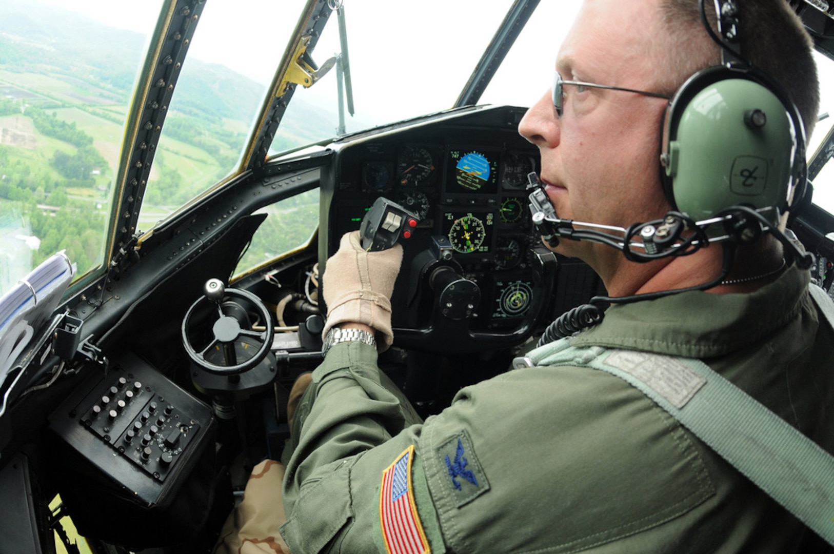Air Force Col. Roger Williams Jr., an instructor pilot with the 156th Airlift Squadron, North Carolina Air National Guard, skirts above the treetops at about 150 feet in a C-130 Hercules aircraft as he locks in on a U.S. Forest Service lead plane during wildland fire suppression training mission in Pisgah National Forest, N.C., May 9, 2012. The aircraft Williams flew was equipped with the Modular Airborne Fire Fighting System II, a tanking system that can hold up to 3,000 gallons of retardant or water used to create firebreaks during aerial wildfire suppression. MAFFS pilots follow lead planes as a guide to aid them with where to lay these firebreaks for maximum effectiveness