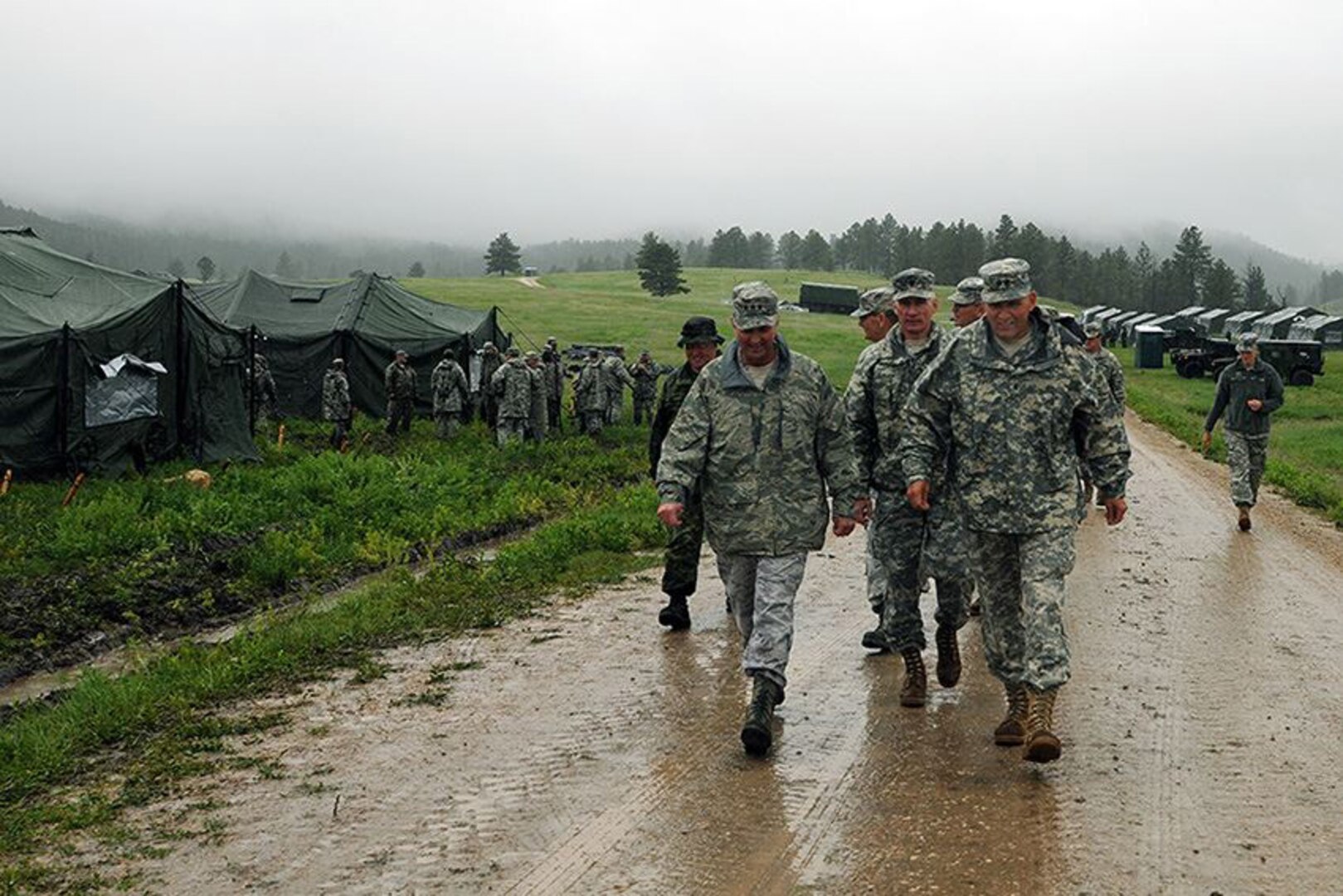 The Vice Chief of the National Guard Bureau, Air Force Lt. Gen. Joseph L. Lengyel, left, and Maj. Gen. Tim Reisch, the adjutant general of the South Dakota National Guard, visit Forward Operating Base Custer in Custer State Park, S.D., as a part the 30th annual Golden Coyote training exercise June 8, 2014. Lt. Gen. Lengyel visited the exercise where National Guard, Reserve, active-duty and allied nation forces come together for two-weeks to train in support of overseas contingency operations and homeland support missions. 