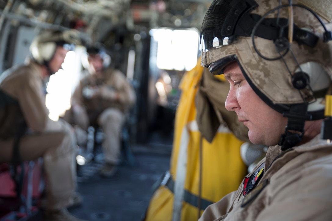 Captain Ian Gough, a CH-46E Sea Knight helicopter pilot with Marine Medium Helicopter Squadron 774, 4th Marine Aircraft Wing, Marine Forces Reserve, rides as a passenger in a CH-46E Sea Knight helicopter before his flying time during an area familiarization flight as part of Integrated Training Exercise 4-14 here June 7, 2014. The flight was the first flight operation conducted during the two-week exercise and the first time the squadron’s pilots had flown in a desert environment since last year’s ITX. ITX is the largest Marine Corps Reserve training exercise with more than 4,000 Marines and sailors participating from units across the United States. The exercise focuses on the tactical application of combined-arms during global contingencies.